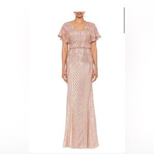 Betsy and Adam sequined v-neck gown. Light pink, perfect for a formal event.